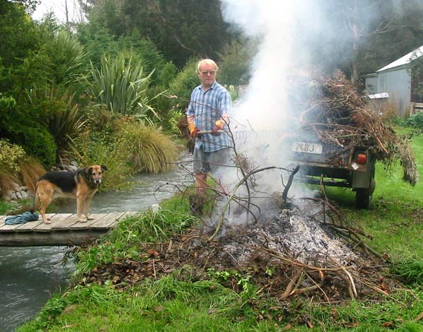  One of the many loads of fallen tree rubbish going on the fire. 